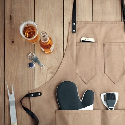Tablier en toile enduite avec attributs en cuir